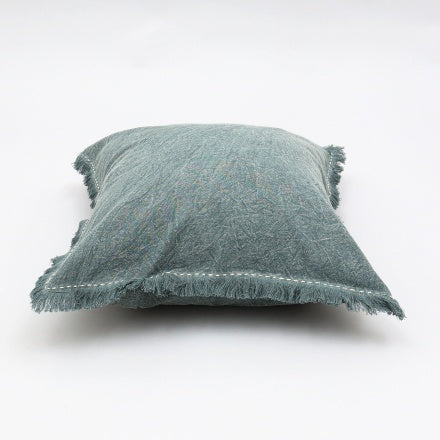 Shopi Vella stonewashed linen throw pillow with fringed edges in soft muted green color