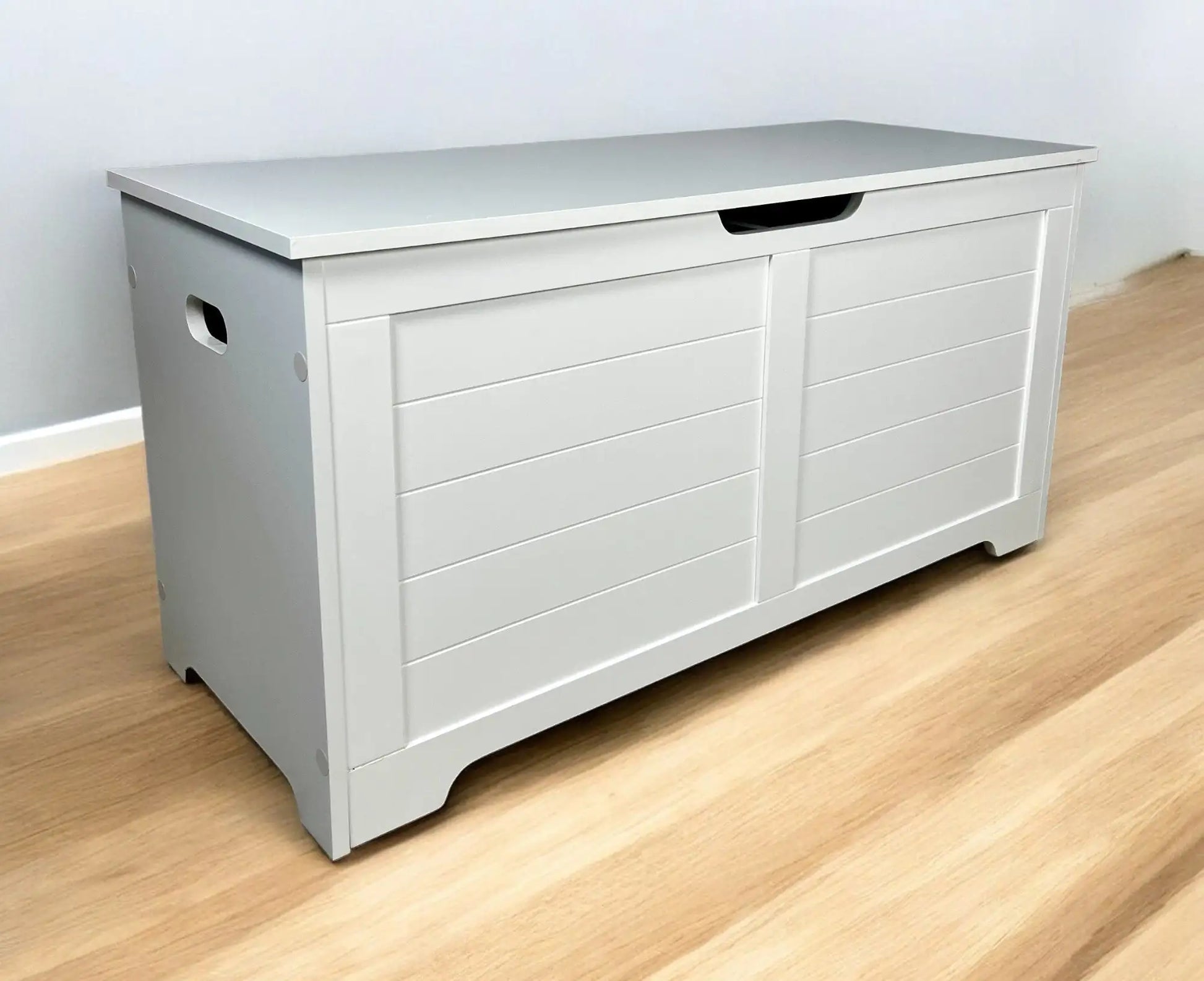 White top open litter box furniture with dual sliding doors and side handles on wooden floor