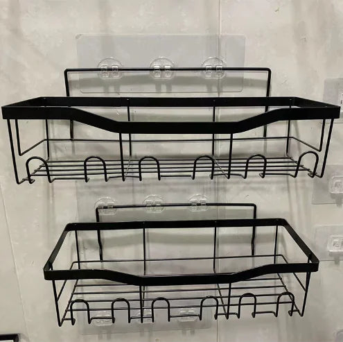 Black metal wall-mounted shower storage rack with two-tier shelves and hooks for bathroom organization