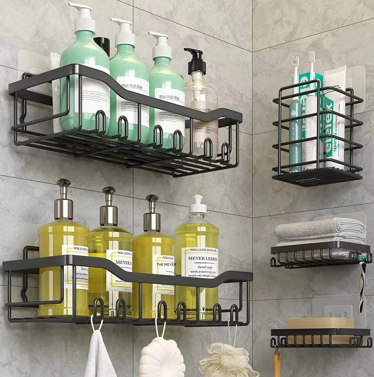 Black metal wall-mounted shower storage rack holding bottles and bathroom essentials on gray tile walls