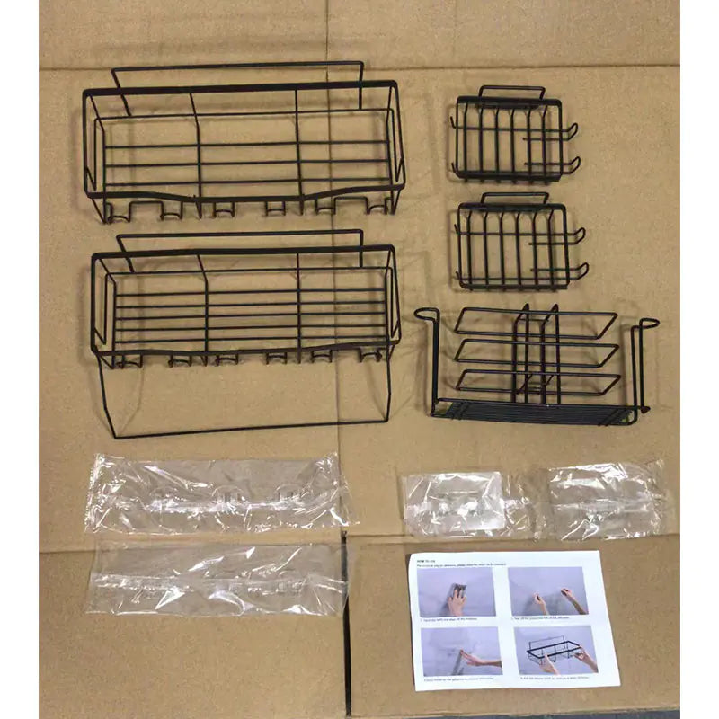 Black metal wall-mounted shower storage rack set with multiple compartments and hooks for bathroom organization