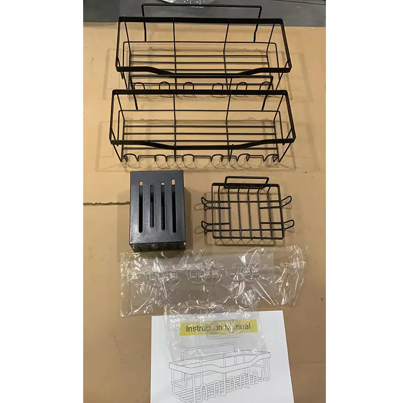 Black metal wall-mounted shower storage rack with multiple shelves and hooks, including mounting hardware and instructions