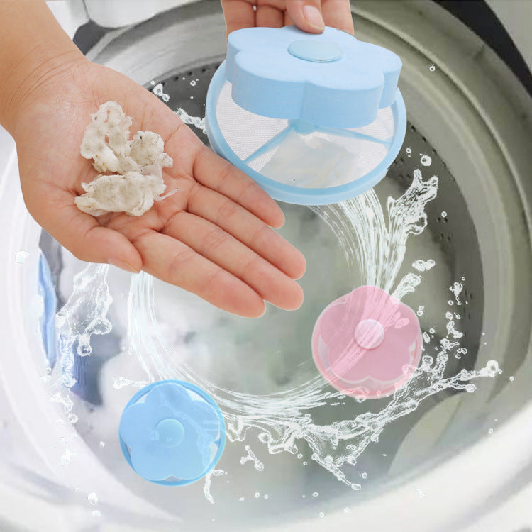 Shopi Vella washing machine hair catcher in blue and pink floating in washer drum to collect lint and hair