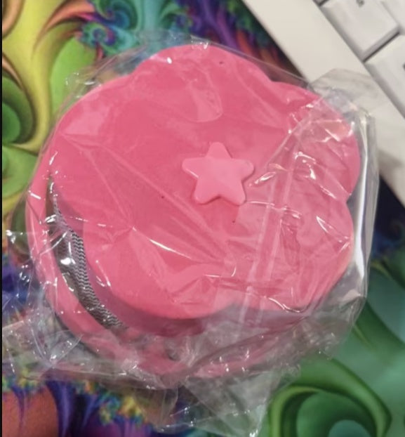 Pink washing machine hair catcher with star design for bathroom storage by Shopi Vella
