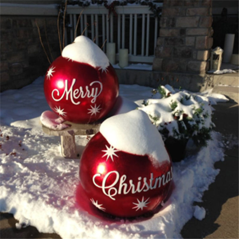 Shopi Vella giant outdoor Christmas ornament ball set with Merry and Christmas text in snow-covered yard