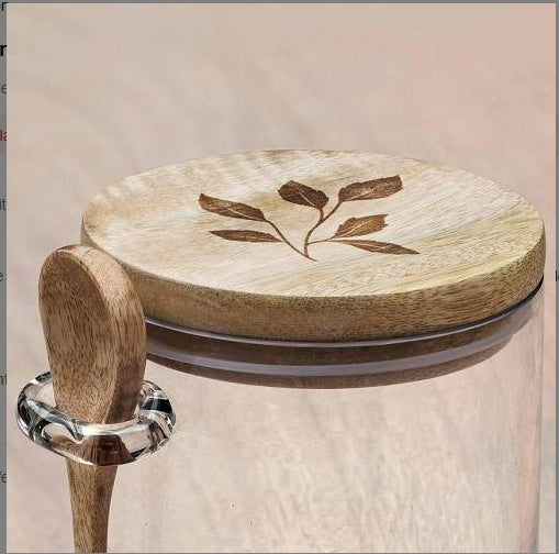 Shopi Vella glass kitchen storage jar with wooden lid featuring leaf design and matching wooden spoon