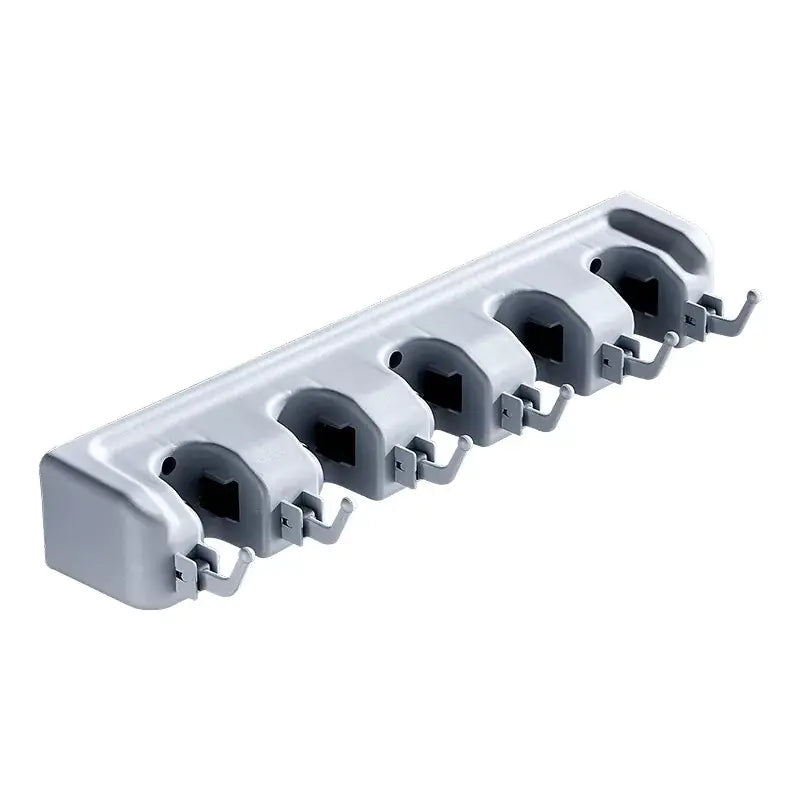 White wall-mounted mop and broom holder with six adjustable slots for organizing cleaning tools
