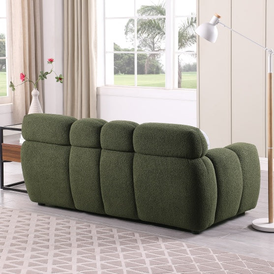 Shopi Vella green upholstered sofa with plush cushions in a modern living room setting