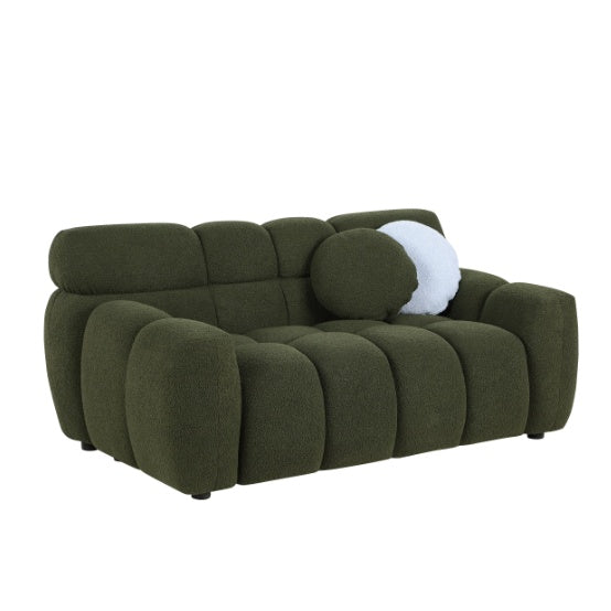 Shopi Vella green upholstered sofa with plush cushioning and rounded armrests for modern living rooms