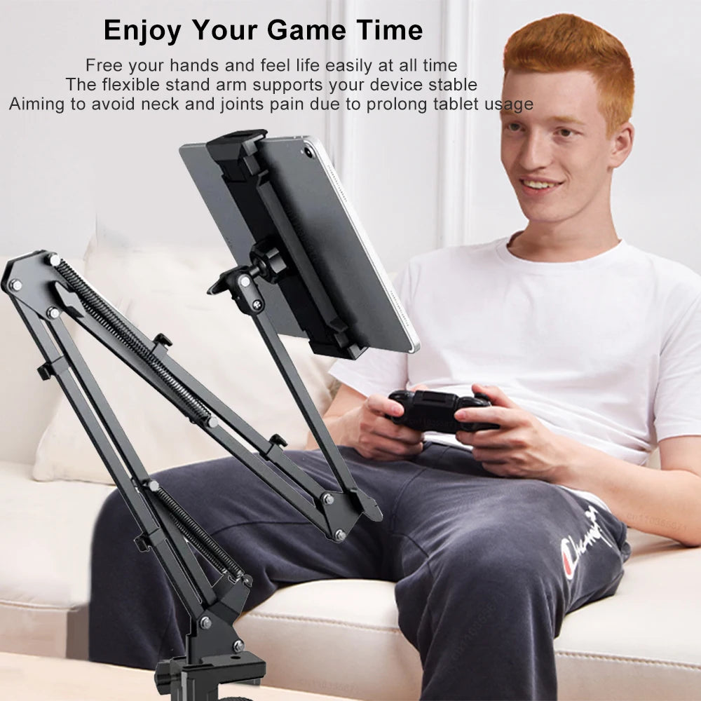 Hands free phone mount for bed with adjustable arm holding a tablet next to a person sitting on a couch