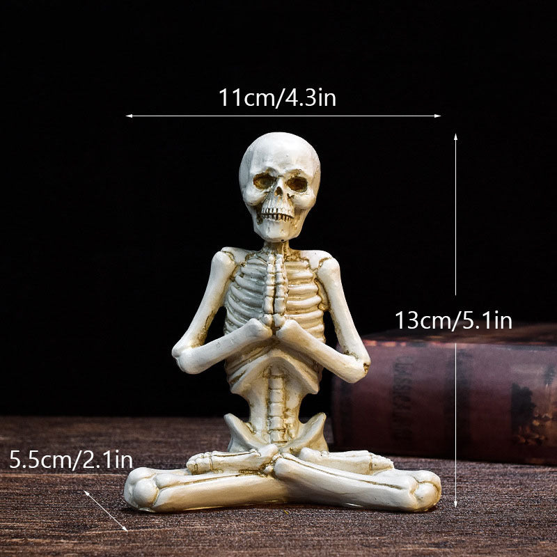 Halloween yoga skeleton decor sitting in yoga pose with hands together, measuring 13cm tall by 11cm wide
