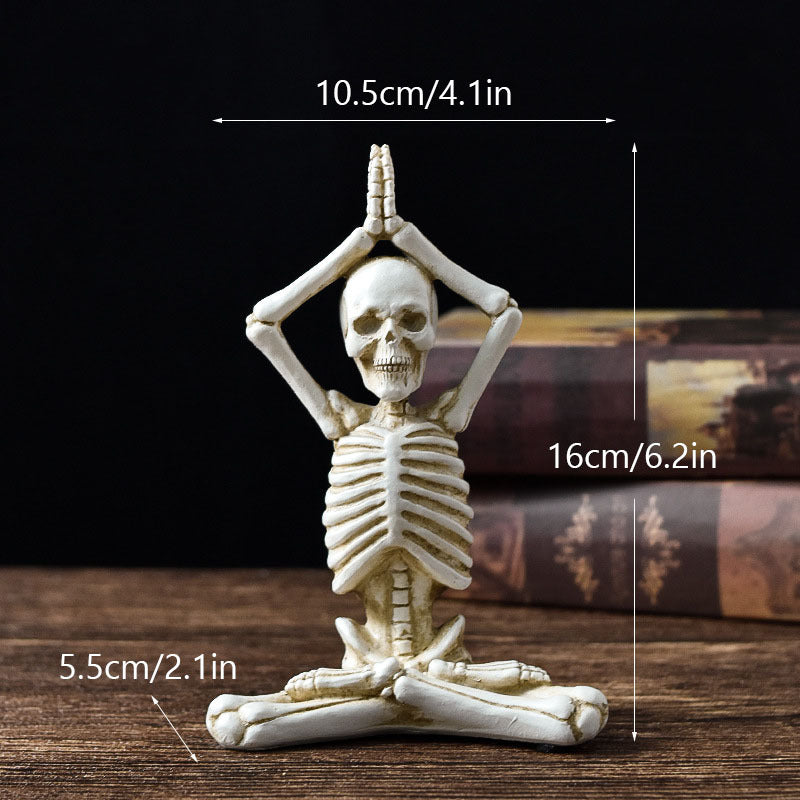 Halloween yoga skeleton decor measuring 16cm tall in a seated meditation pose on wooden surface