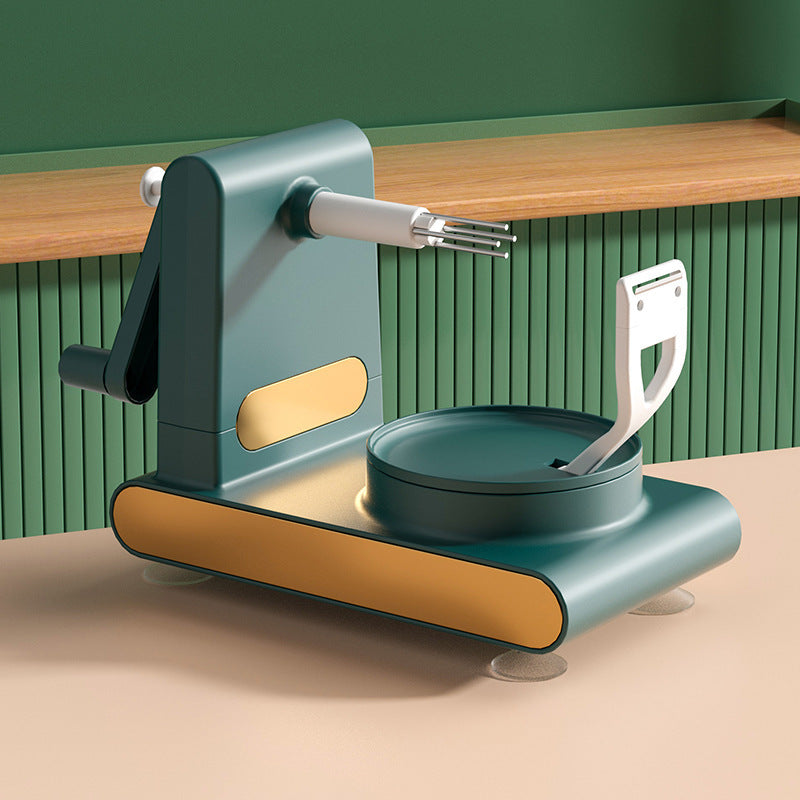 Shopi Vella hand-cranked fruit peeler machine in green and gold for efficient kitchen storage and peeling