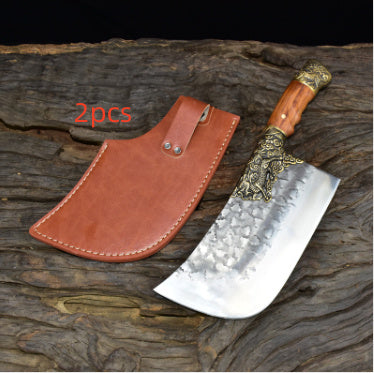 Hand-forged bone chopping knife with decorative handle and brown leather sheath on wooden surface
