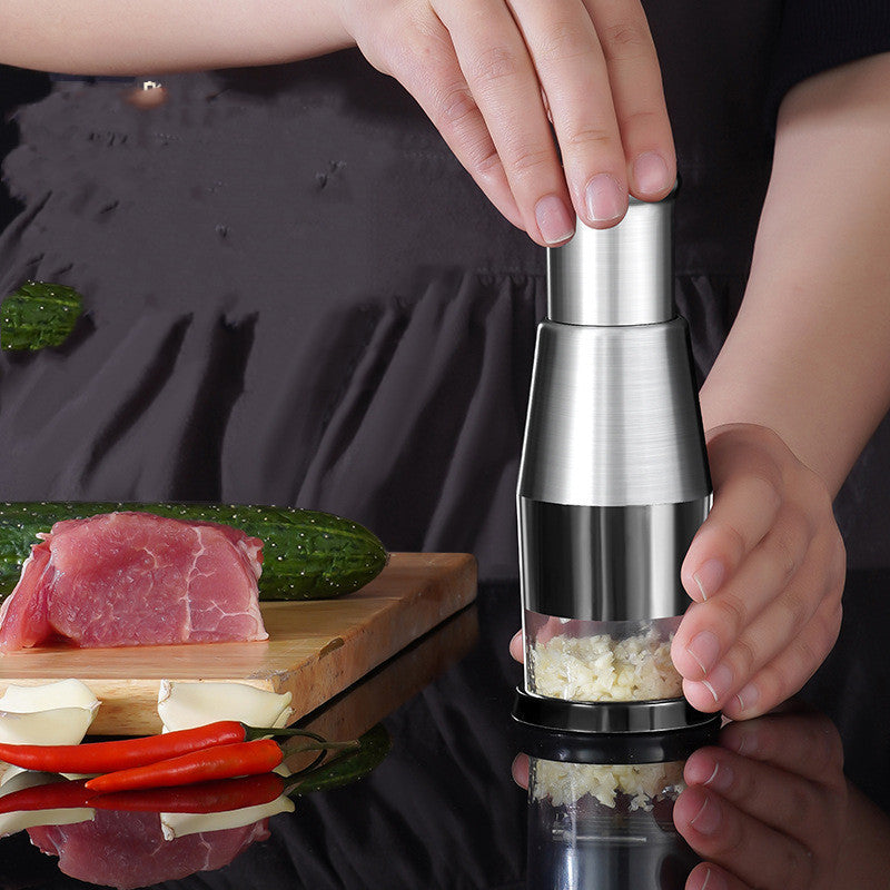 Shopi Vella stainless steel garlic crusher onion chopper being used to crush garlic in kitchen