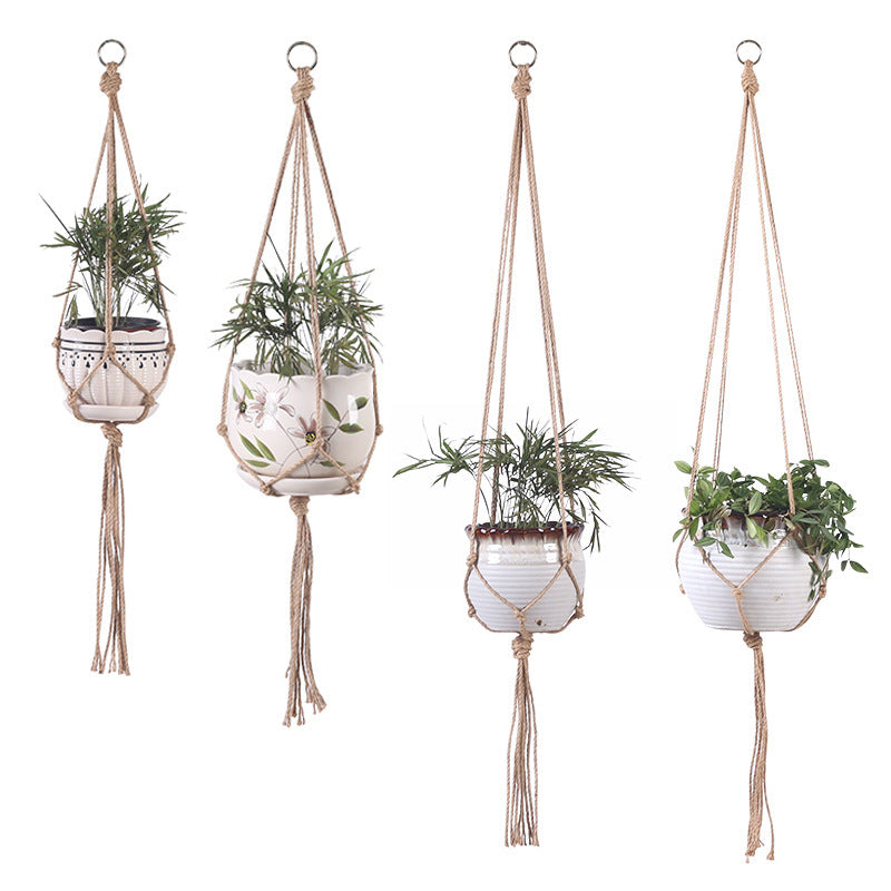Shopi Vella hand-woven hanging basket set with four natural jute plant hangers holding white ceramic pots