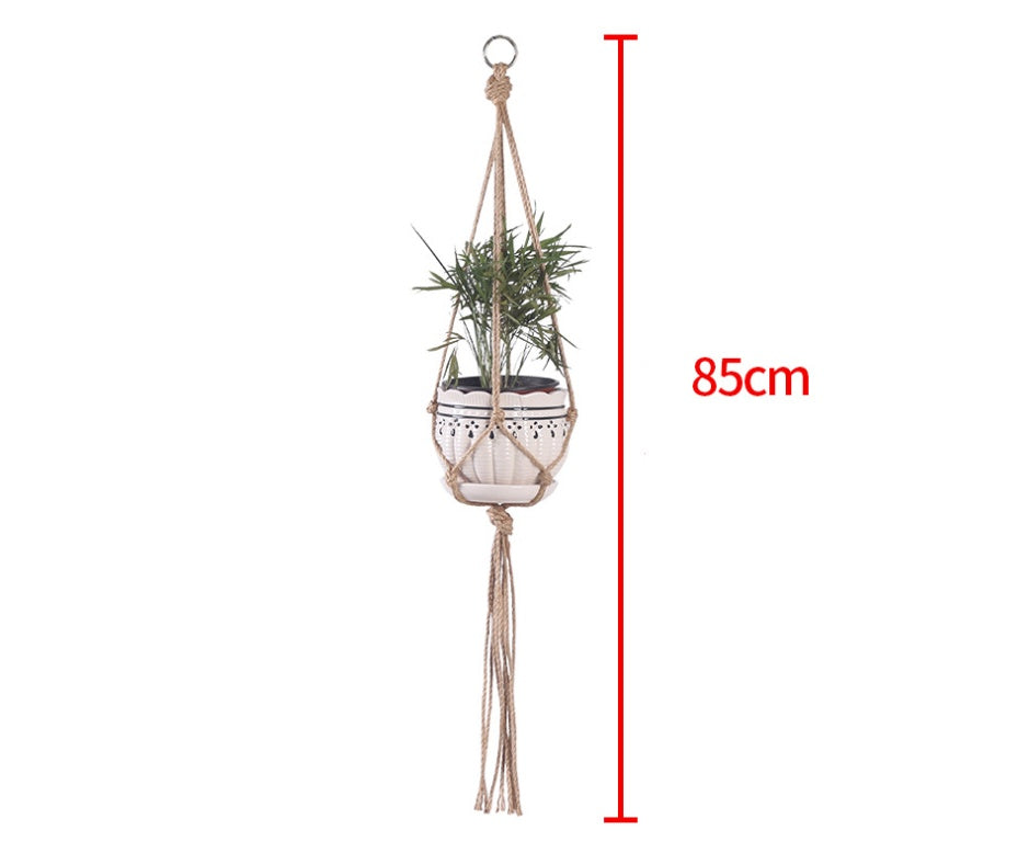 Shopi Vella hand-woven hanging basket holding a green plant with an 85cm length measurement