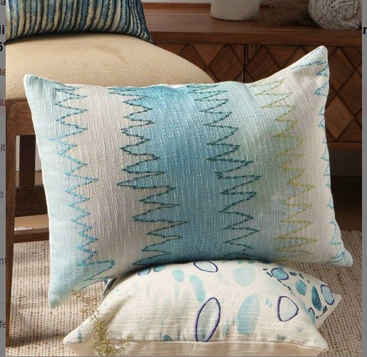 Shopi Vella handcrafted foliage pillow case with blue and green zigzag pattern on white fabric
