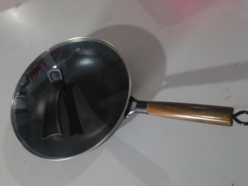 Shopi Vella handmade iron wok with wooden handle and glass lid for versatile cooking