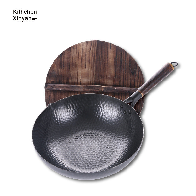 Shopi Vella handmade iron wok with textured surface and wooden handle with wooden lid