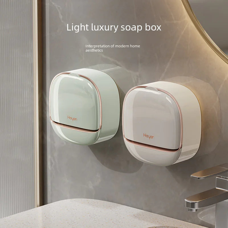 Modern wall mounted soap dish in pastel green and white with rose gold accents on bathroom wall