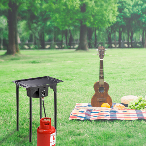 Shopi Vella high pressure propane gas burner with red propane tank outdoor cooking tool on grass