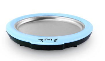 Shopi Vella homemade rolled ice cream machine with blue rim and stainless steel freezing surface