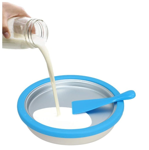 Shopi Vella homemade rolled ice cream machine with blue spatula and pouring milk on cold plate