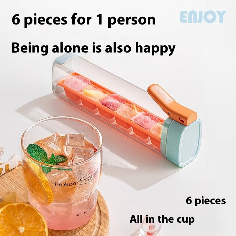 Household ice cube tray with storage by Shopi Vella holding six colorful ice cubes in a transparent container