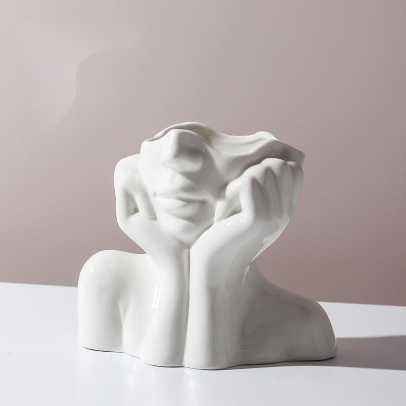 Shopi Vella white human body ceramic vase shaped like a resting face with hands under chin