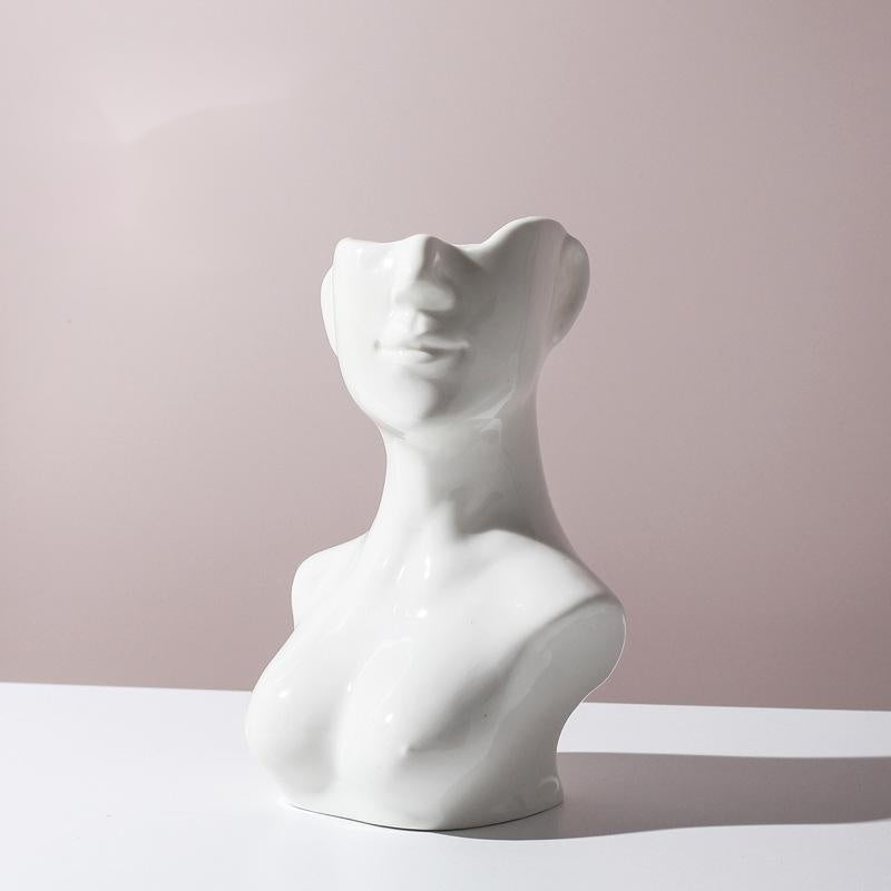 Shopi Vella white human body ceramic vase shaped like an abstract female torso and face for elegant storage
