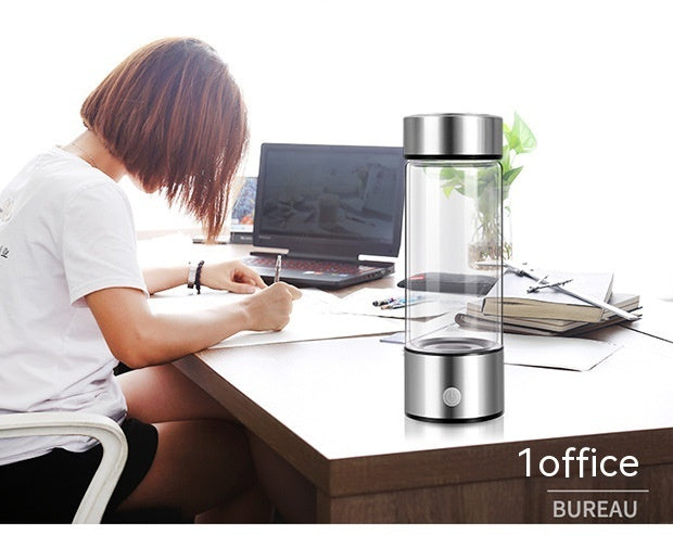 Shopi Vella hydrogen water bottle portable with sleek design on office desk near woman working