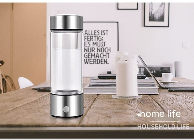Shopi Vella hydrogen water bottle portable with sleek silver design on wooden kitchen table