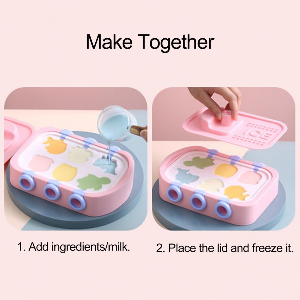 Shopi Vella ice hockey maker for kids in pink with colorful ice mold shapes and lid being placed