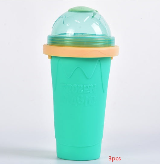 Shopi Vella instant frozen drink cup in teal with dome lid and orange rim for cold beverages
