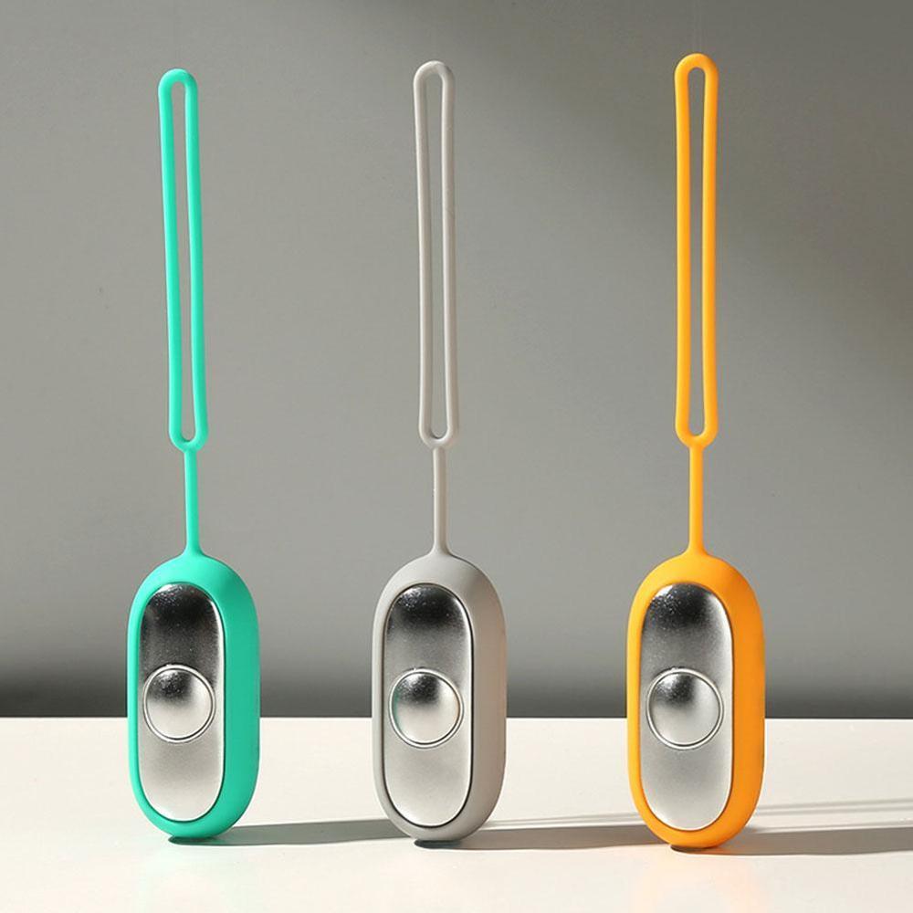 Shopi Vella intelligent sleep therapy device in teal gray and orange with hanging loop for home storage
