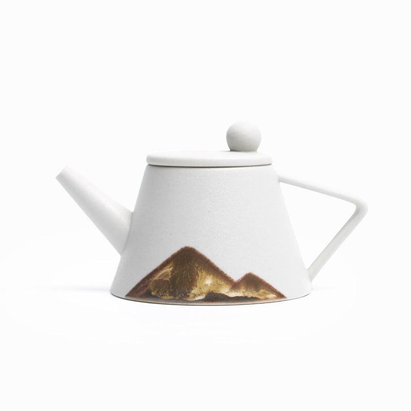 Shopi Vella Japanese ceramic teapot with white finish and artistic mountain design