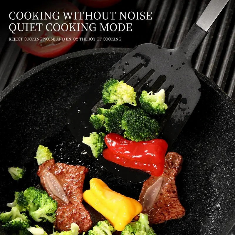 Shopi Vella kitchen utensil gift set black spatula lifting vegetables and steak in pan