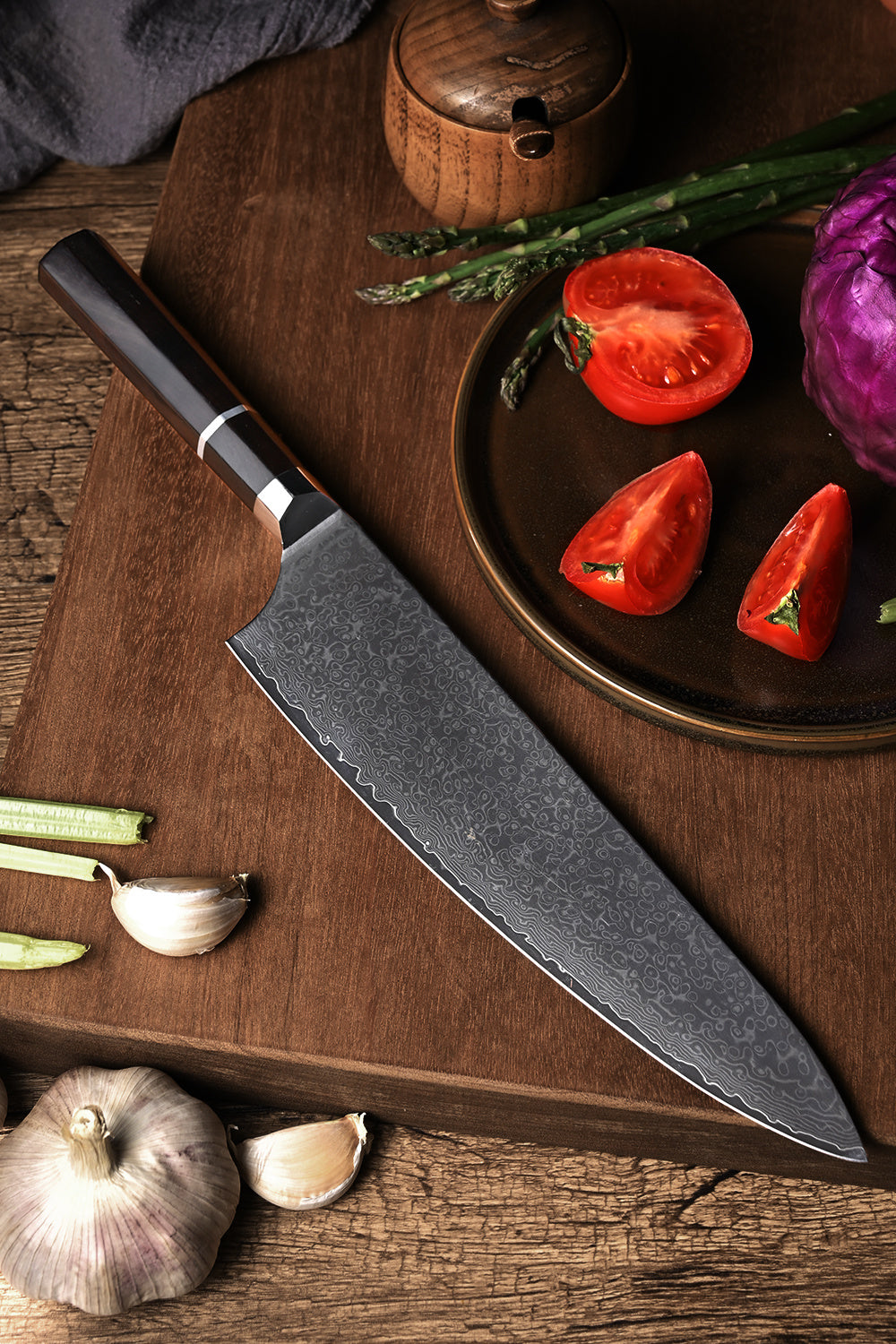 8 inch Damascus sushi knife with patterned blade and dark handle on wooden cutting board with vegetables