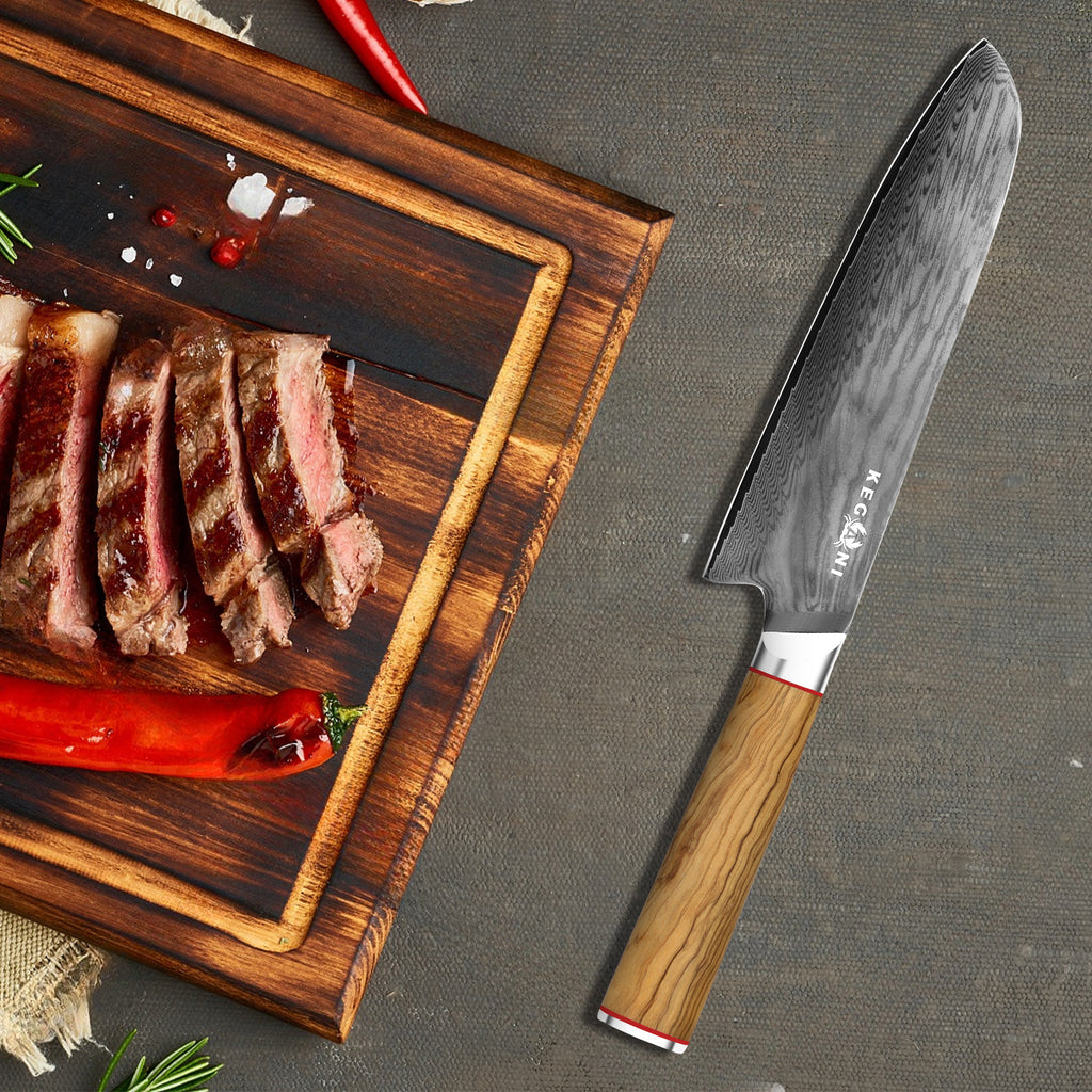 Shopi Vella 8 inch kiritsuke kitchen knife with wooden handle next to sliced steak on wooden cutting board