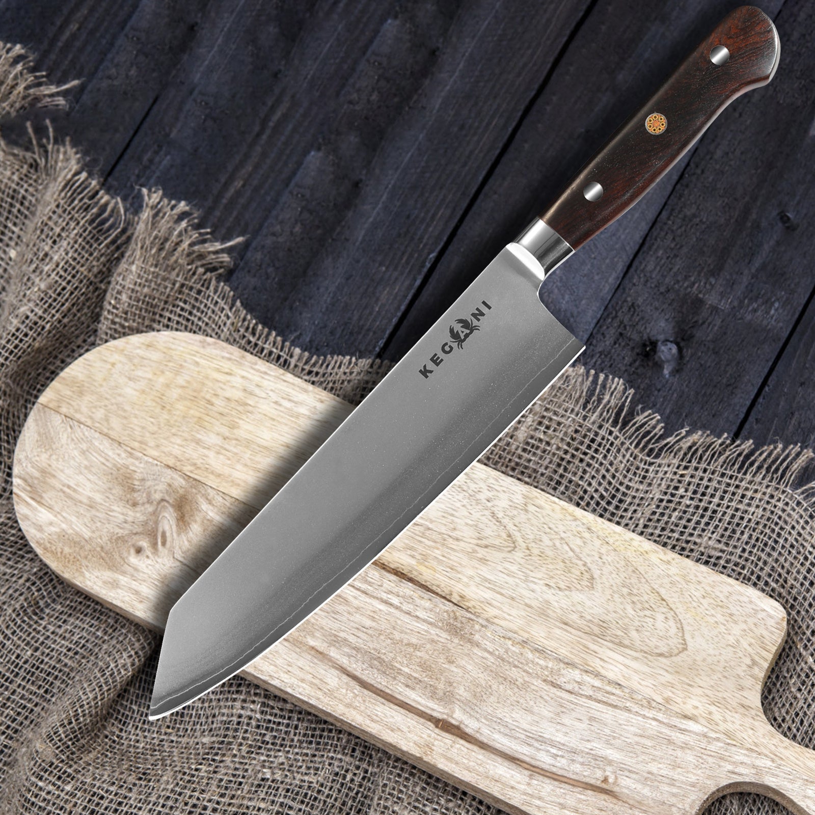 Shopi Vella ergonomic handle chef knife with wooden handle resting on wooden cutting board