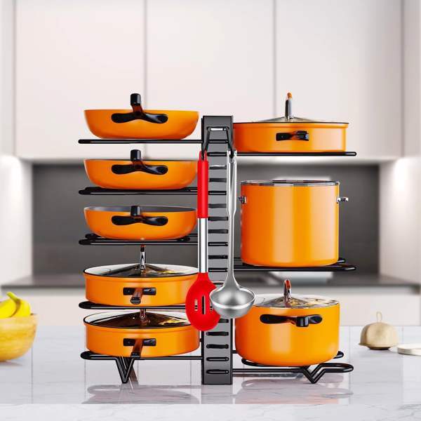 Shopi Vella kitchen cabinet organizers holding orange pots and pans with hanging kitchen utensils