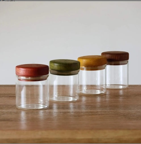Shopi Vella kitchen canister set for pantry organization with clear glass jars and colored wooden lids