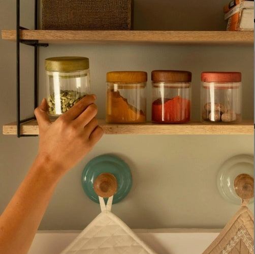Shopi Vella kitchen canister set for pantry organization with colorful lids on wooden shelf