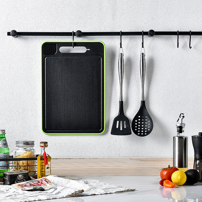 Shopi Vella kitchen chopping board with knife sharpener hanging on wall rack in modern kitchen