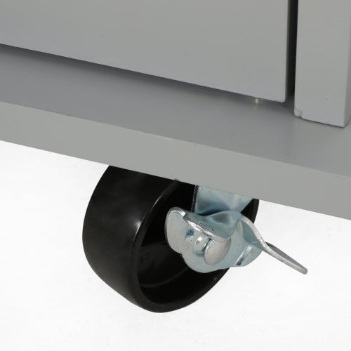 Close up of black caster wheel with metal brake on a kitchen island on wheels by Shopi Vella