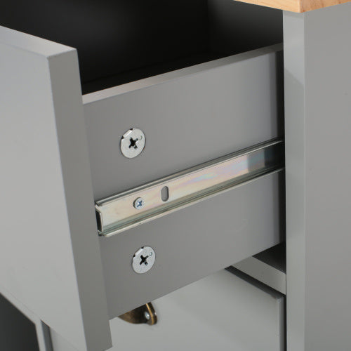 Close-up of drawer slide mechanism on gray kitchen island on wheels by Shopi Vella