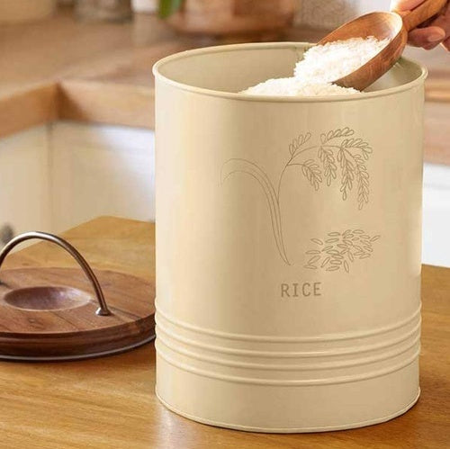 Shopi Vella kitchen rice canister with wooden lid in beige with rice scoop inside on wooden countertop