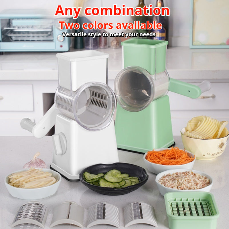 Shopi Vella kitchen vegetable slicer in white and green with multiple blades and sliced vegetables on counter