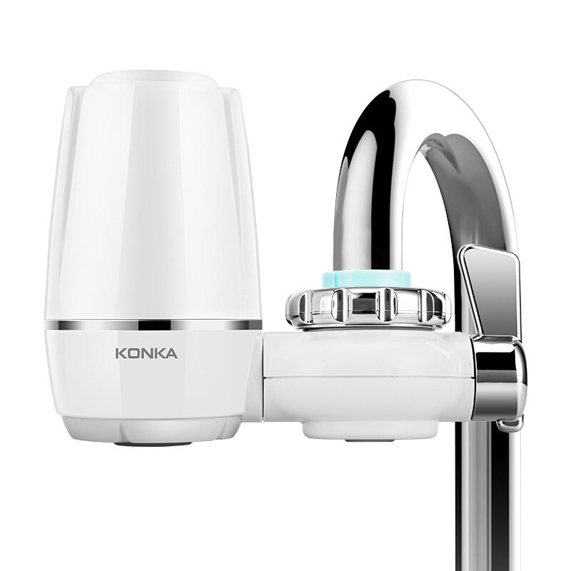 White Konka kitchen faucet water filter attached to a chrome kitchen faucet for purified water